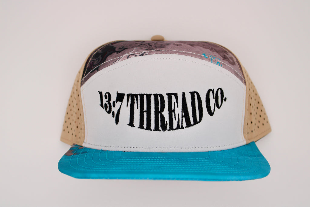 White, blue, tan 7 panel snapback hat - Arc Font